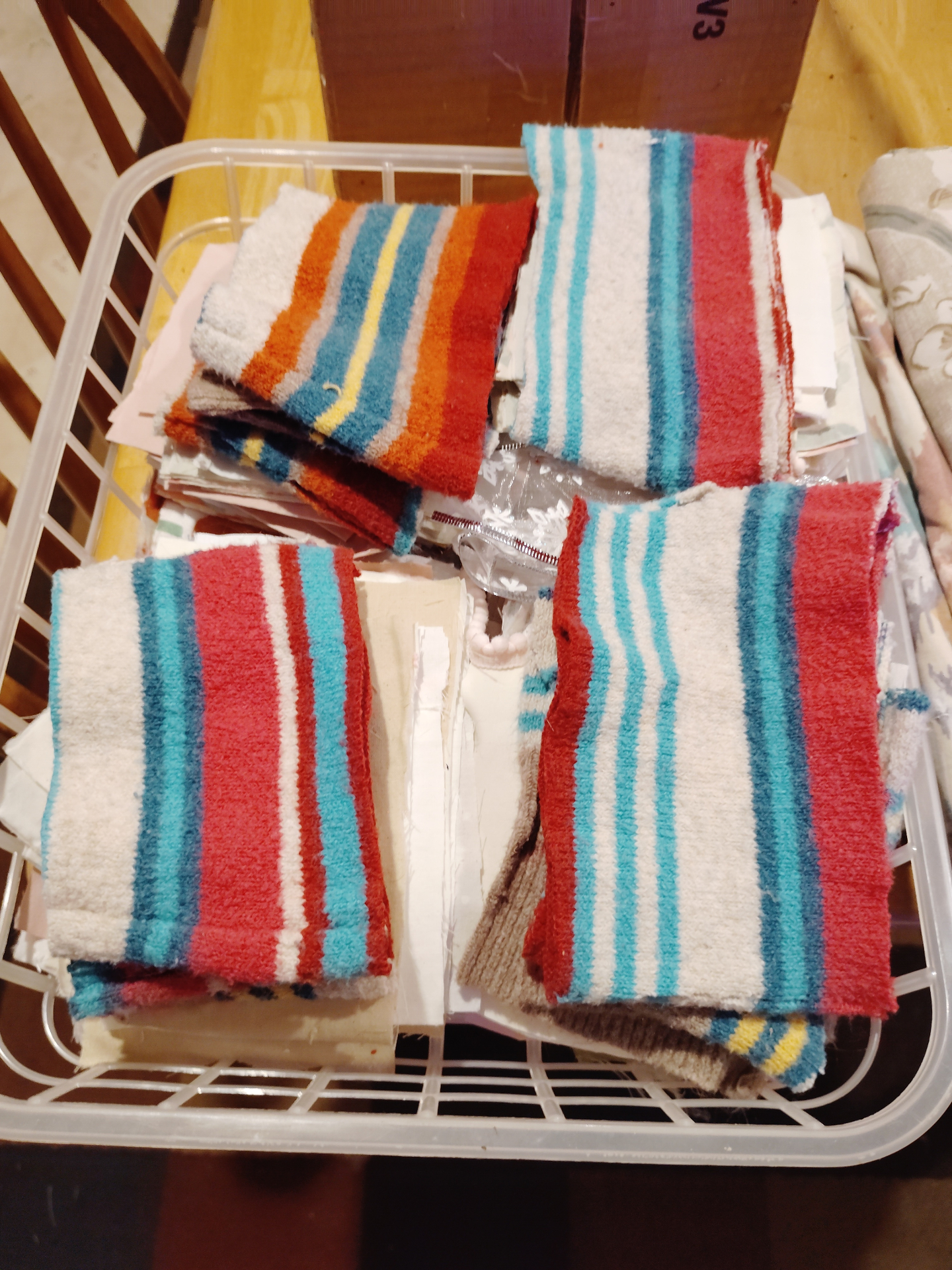 A basket filled with cut striped fabric pieces prepared for future Soul Cloth work